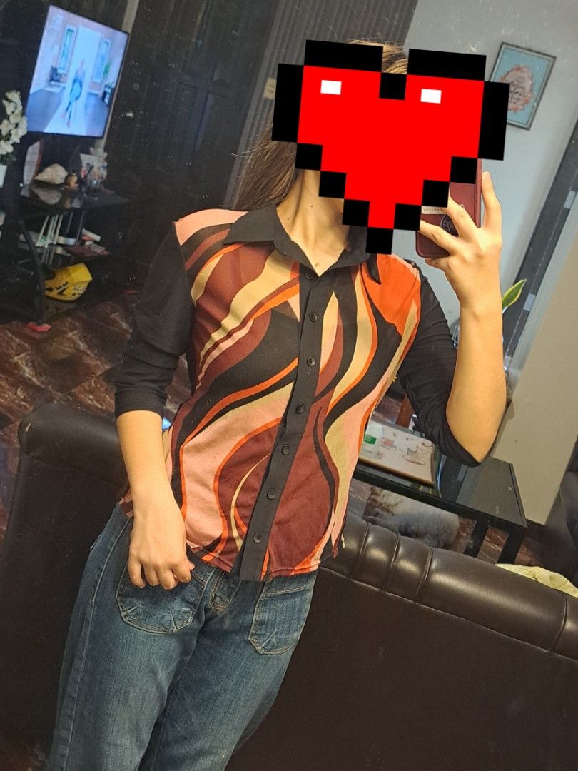 Unit One Abstract Wave Red Button-Down Blouse Y2K/Vintage (Category: Blouses) located in Iligan City. Submitted by xania_danielle03 (Listing ID 1468075813, Image 1). Description: - Brand: Unit One - Size: S (tag on collar) - Design: Colorful abstract wave pattern (orange, maroon, pink, cream) on front - Details: Solid black collar, placket, and sleeves with button-up closure - Material: Lightweight, sheer fabric.