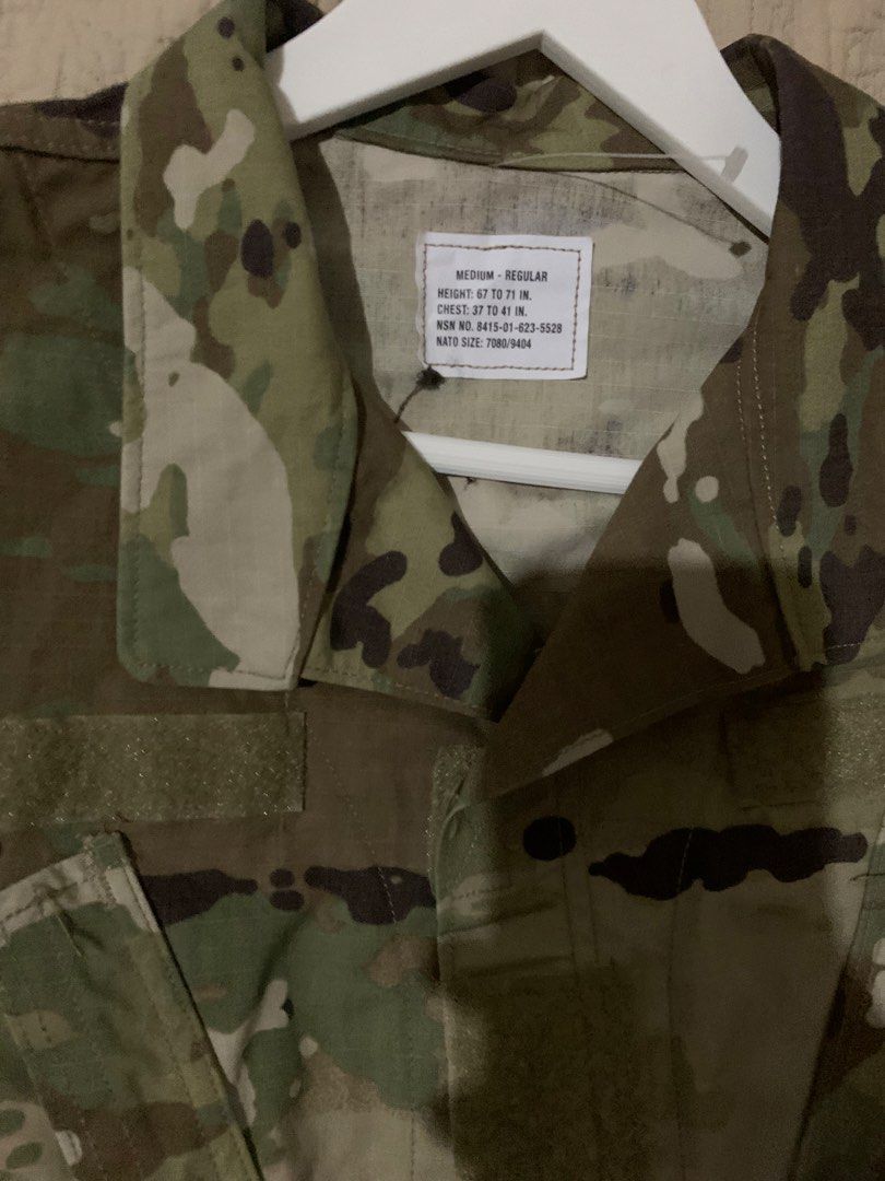 US Army OCP Multicam Combat Jacket Medium Regular (Category: Coats, Jackets and Outerwear) located in Manila. Submitted by spaceshop12345 (Listing ID 1468178983, Image 3). Description: - Authentic US Army OCP Multicam combat coat - Size: Medium Regular (fits chest 37-41", height 67-71") - NSN: 8415-01-623-5528 - Features Velcro panels on chest and sleeves for patches - Secure button front closure with protective fabric flap - Premium tactical gea