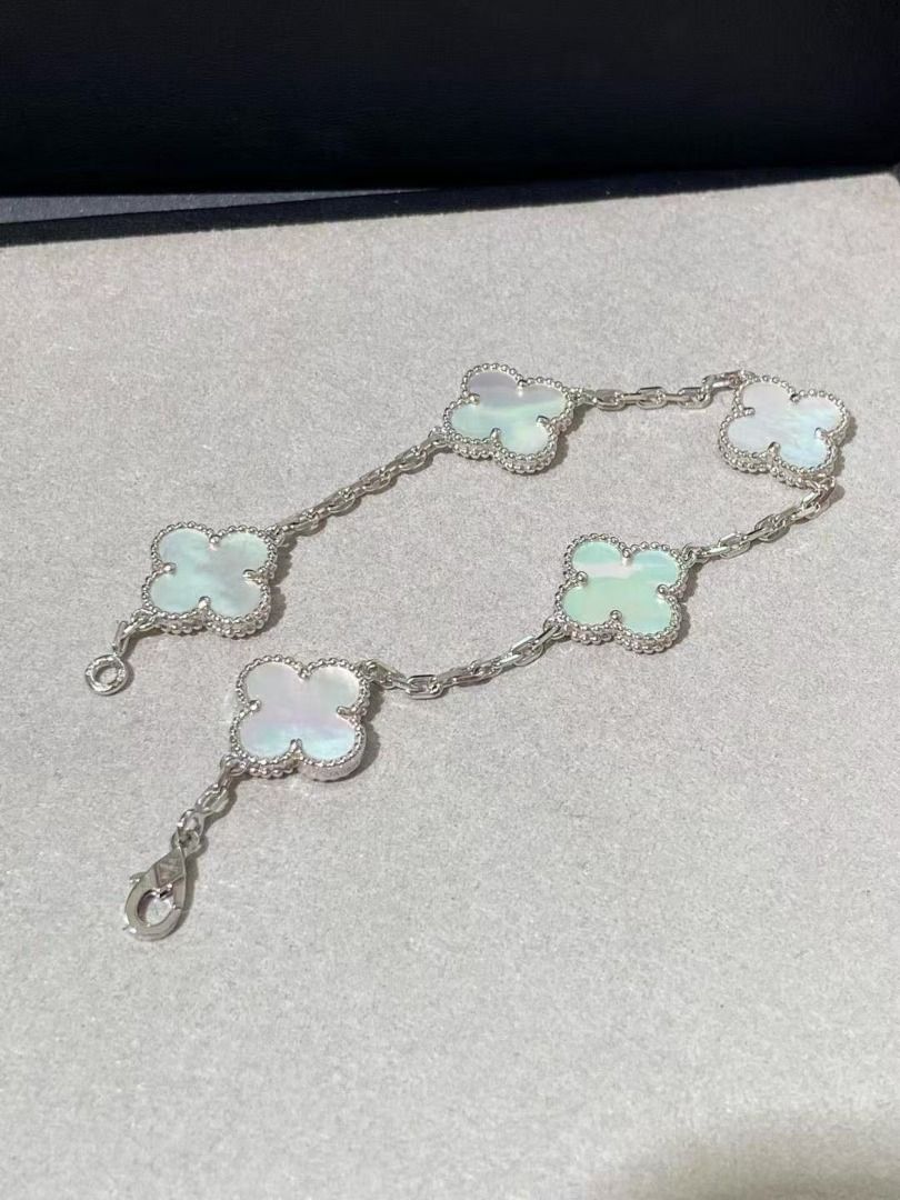 Van Cleef & Arpels Alhambra clover motif bracelet (Category: Bracelets) located in Mandaluyong City. Submitted by sadihaviur09733 (Listing ID 1468124705, Image 3). Description: - Design: Silver-tone chain with four-leaf clover motifs - Details: Alternating mother-of-pearl style white clovers and sparkly pavé crystal clovers - Closure: Secure lobster clasp with adjustment links for a custom fit - Fit: Standard length, delicate and versatile - Cond