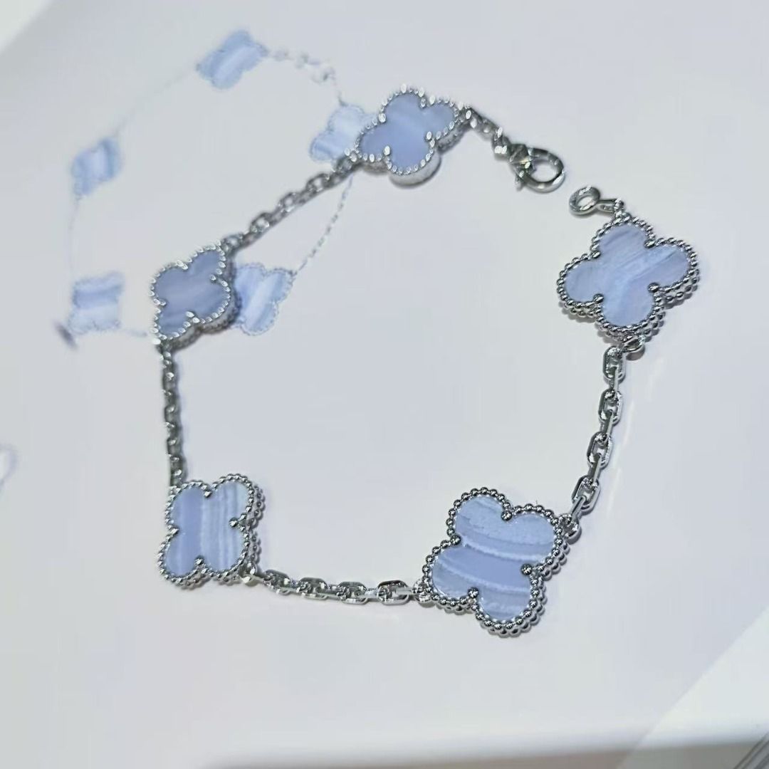 Van Cleef & Arpels Vintage Alhambra Blue Agate Bracelet (Category: Bracelets) located in Quezon City. Submitted by reifancova27621 (Listing ID 1468139974, Image 1). Description: - Silver-tone chain bracelet in classic Alhambra style - Features five clover motifs in banded light blue chalcedony or agate stone - Delicate beaded border around each clover - Secure lobster clasp closure - Clean metalwork and stones in great shape.