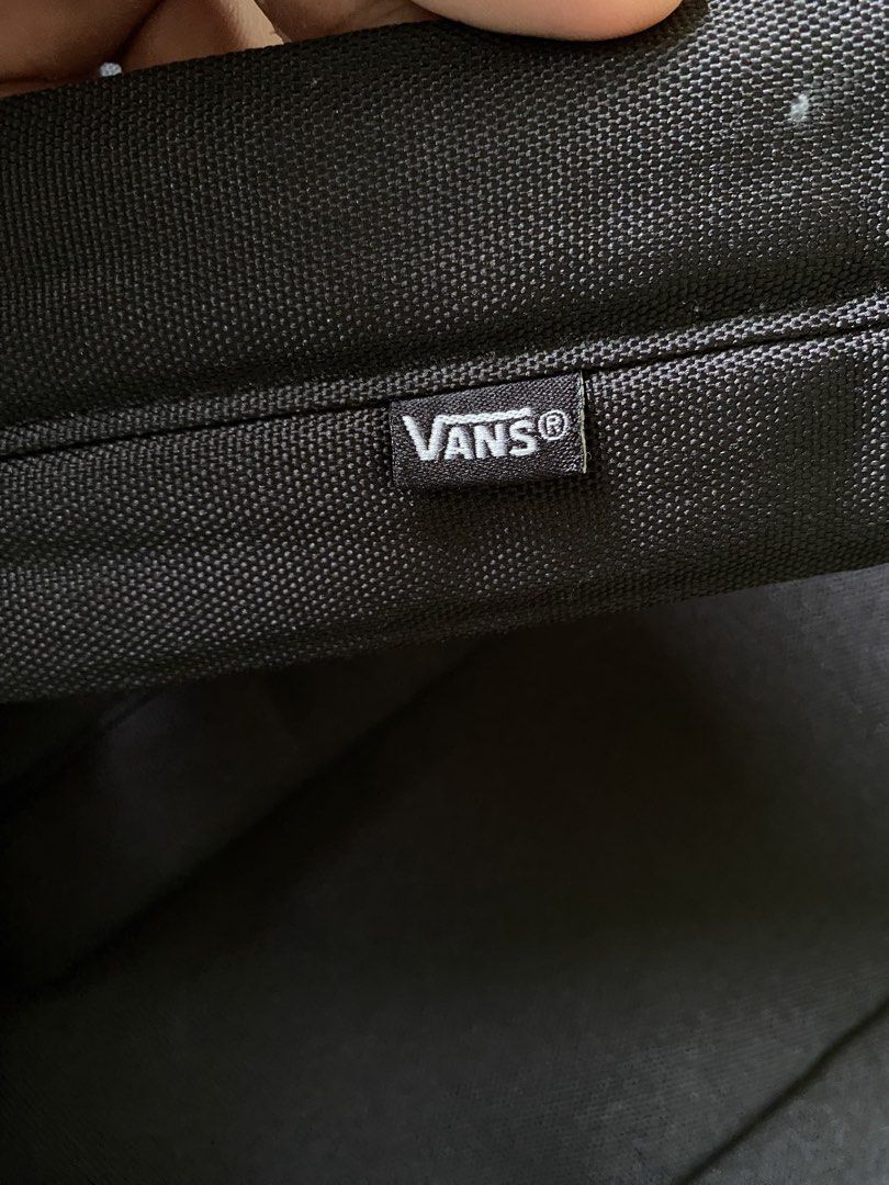 Vans Black Backpack with Embroidered Logo (Category: Backpacks) located in Manila. Submitted by diporosmoh43681 (Listing ID 1468064520, Image 3). Description: - Classic black Vans backpack with large embroidered white logo - Durable canvas material with dual zipper closures and branded metal pulls - Adjustable padded shoulder straps for comfortable everyday wear - Comes with a trendy, detachable NewJeans Supernatural keychain - Perfect standard s