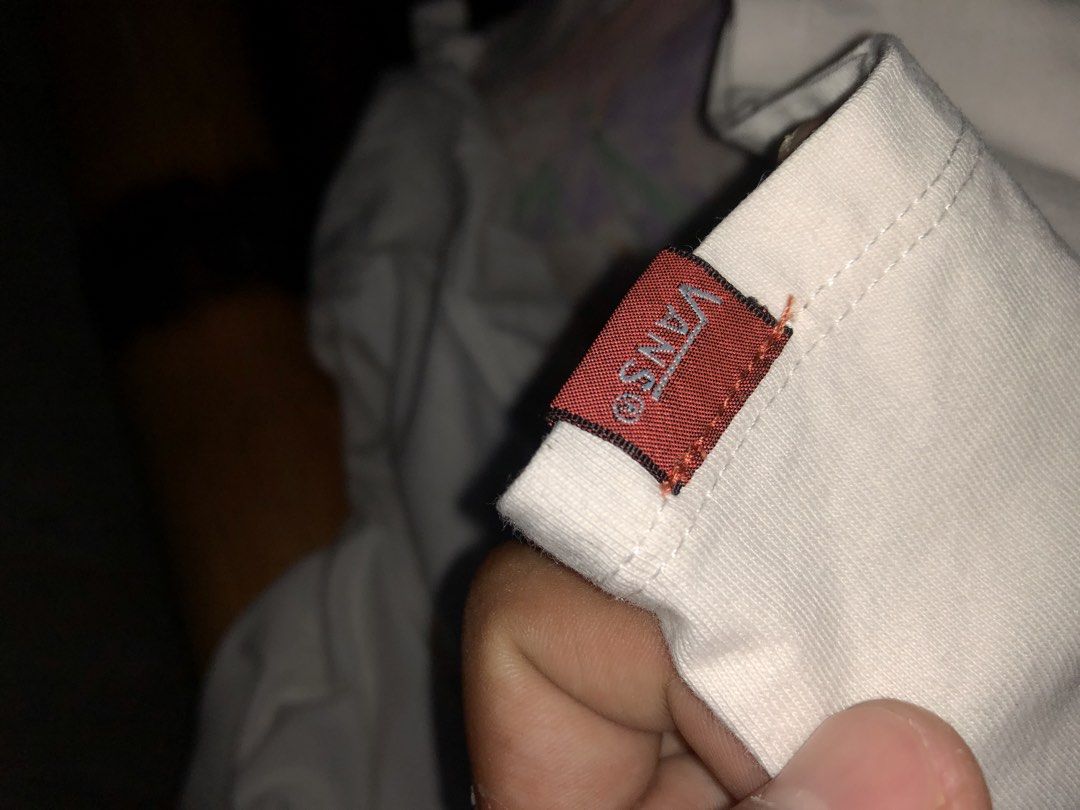 Vans Classic Red Logo White T-Shirt (Category: Tshirts & Polo Shirts ) located in Magsaysay. Submitted by ryns_thrifting (Listing ID 1468164929, Image 3). Description: - Brand: Vans - Style: Crew neck short sleeve tee - Color: White with classic red box logo - Size: Small - Details: Red woven tag on left sleeve hem, 'Off The Wall' interior neck print - Material: Clean, comfortable cotton.