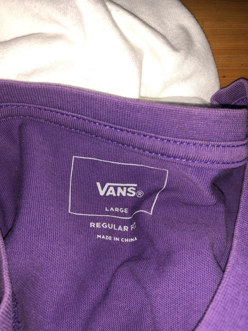 Vans Purple Regular Fit T-Shirt Large (Category: Tshirts & Polo Shirts ) located in Magsaysay. Submitted by ryns_thrifting (Listing ID 1468165009, Image 2). Description: - Brand: Vans - Color: Purple with white box logo - Size: Large (Regular fit) - Style Code: VN0A4MM630X - Material/Origin: Made in China - Condition: Standard everyday skate wear, crew neck collar.