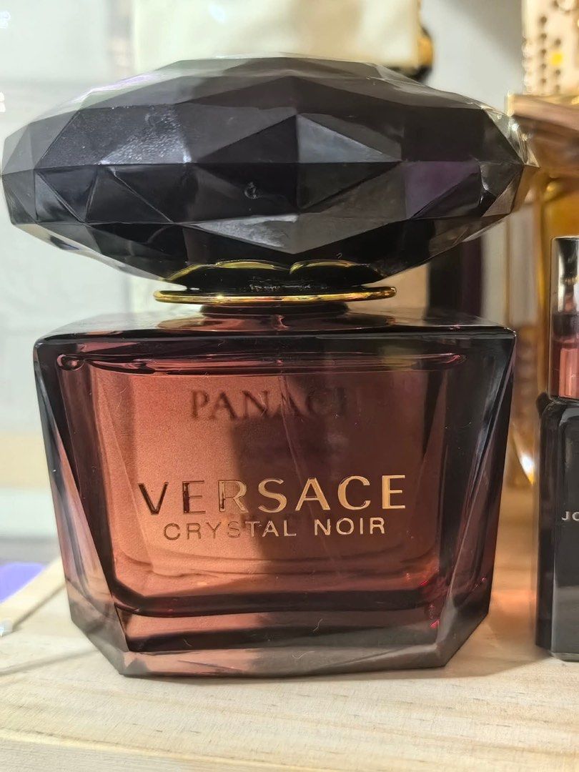 Versace Crystal Noir Eau De Parfum in Tester box (Category: Fragrance & Deodorants) located in Pasig City. Submitted by lamzy102 (Listing ID 1468106502, Image 3). Description: - 100% Original Versace Crystal Noir Eau de Parfum - with tester box - Features the iconic dark purple heavy glass design and diamond-shaped cap - Perfect for gifting or daily signature scent *Please check juice level on pics •Negotiable Located in Santolan Pasig.