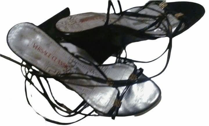 Versace Classics Black Lace-Up Wedge Sandals (Category: Wedges) located in Paranaque City. Submitted by calm_youngstore7 (Listing ID 1468098821, Image 3). Description: - Brand: Versace Classics - Color: Black with gold hardware accents - Style: Strappy wedge sandals with lace-up ankle ties - Condition: Worn a few times, minor wear on soles and inner footbeds - Details: Features Versace branding prints on the insoles - Meet-ups or shipping via J&T