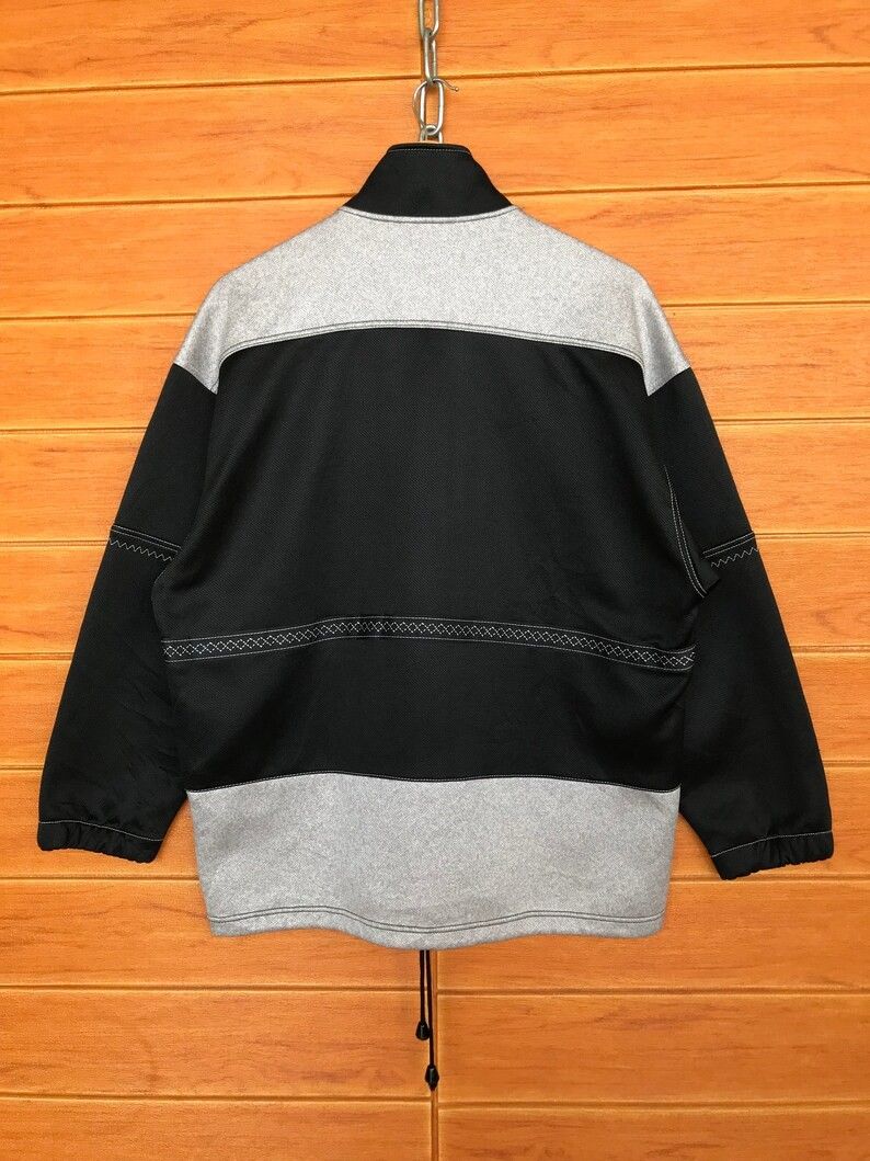 Vintage 1990s Asics Full Zip Track Jacket (Category: Coats, Jackets and Outerwear) located in Cebu City. Submitted by south_thrift (Listing ID 1468283222, Image 2). Description: Vintage 1990s Asics Full Zip Track Jacket 25" X 29" Dimensions Originating from the 1990s, this Asics full-zip track jacket showcases the brand's technical sportswear design language from that era. Asics became a global powerhouse in athletics during the late twentieth ce