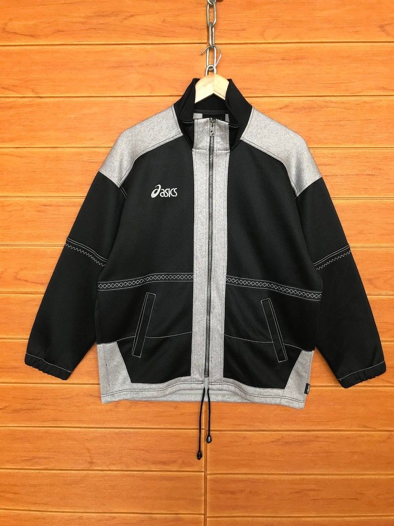 Vintage 1990s Asics Full Zip Track Jacket (Category: Coats, Jackets and Outerwear) located in Cebu City. Submitted by south_thrift (Listing ID 1468283222, Image 1). Description: Vintage 1990s Asics Full Zip Track Jacket 25" X 29" Dimensions Originating from the 1990s, this Asics full-zip track jacket showcases the brand's technical sportswear design language from that era. Asics became a global powerhouse in athletics during the late twentieth ce