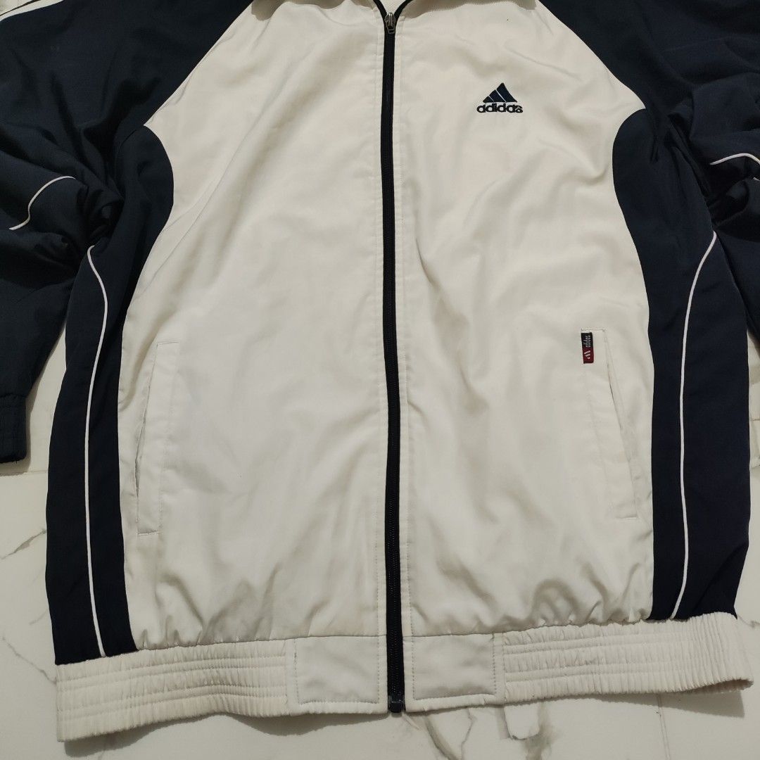 Vintage Adidas Navy White Track Jacket (Category: Coats, Jackets and Outerwear) located in Maria Aurora. Submitted by pewpewww22 (Listing ID 1468169064, Image 3). Description: dimes-24.5 by 28.5 inch 6/10 condition fade neckcollar.