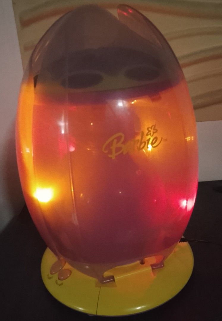 Vintage Barbie Night Light / Tabletop Lamp (Category: Vintage Collectibles) located in Antipolo. Submitted by rielapreloved (Listing ID 1468063169, Image 1). Description: Selling a cute Barbie night light / tabletop lamp. Nice addition to a kids' bedroom, nursery, or for Barbie collectors looking for unique decor display pieces. ​✨ Key Features: ​Design: Official Barbie branding on a purple/pink tulip-inspired dome housing with a yellow base. ​Du