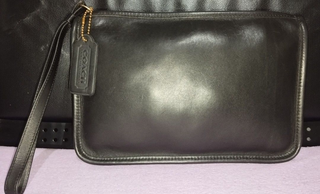 Vintage Coach Zip Top Clutch (Category: Luxury Bags & Wallets) located in Taguig. Submitted by bellecabano (Listing ID 1468177632, Image 2). Description: Vintage Coach Zip Top Clutch Made in the United States, searchable code comes with replace coach hangtag lightly used Lang talaga si clutch parang hindi vintage no rips and tears, no pen/ink/mold marks no uka uka, no cracking and màlambot pa leather ready to use, cleansed and conditioned *** par