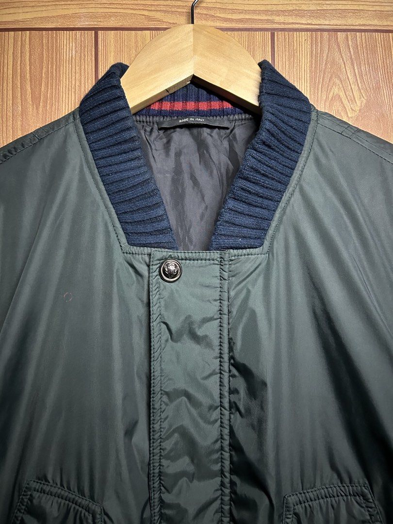 Vintage Gucci 2007 Web Trim Nylon Bomber Jacket (Category: Luxury Apparel) located in Manila. Submitted by zerowasteco. (Listing ID 1466948443, Image 2). Description: -Authentic Gucci Vintage 2007 -Gucci 2007 Web Trim Nylon Bomber Jacket Produced during Gucci’s acclaimed mid-2000s era under Frida Giannini, this bomber jacket interprets classic military flight aesthetics through the lens of Florentine luxury tailoring. Constructed in Italy from re