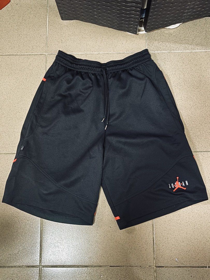 Vintage Jordan Shorts (Category: Shorts) located in Angeles City. Submitted by jaypee2317 (Listing ID 1468122914, Image 1). Description: - Brand: Jordan - Color: Black with bright orange piping and panel accents - Material: Lightweight mesh fabric - Features: Drawstring waistband with silver aglets, iconic Jumpman logo and Jordan lettering near the hem, deep side pockets - Condition: Clean, no tears or stains anywhere.