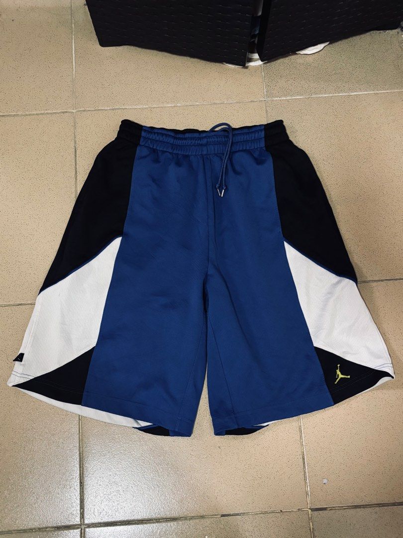 Vintage Jordan Shorts (Category: Shorts) located in Angeles City. Submitted by jaypee2317 (Listing ID 1468123275, Image 1). Description: - Brand: Jordan - Design: Blue, black, and white colorblock with embroidered yellow Jumpman logo - Fit: Elastic waistband with adjustable drawstring - Comfort: Breathable mesh panels on the sides for ventilation - Versatility: Ideal for basketball games, workouts, gym sessions, or casual streetwear - Condition: 