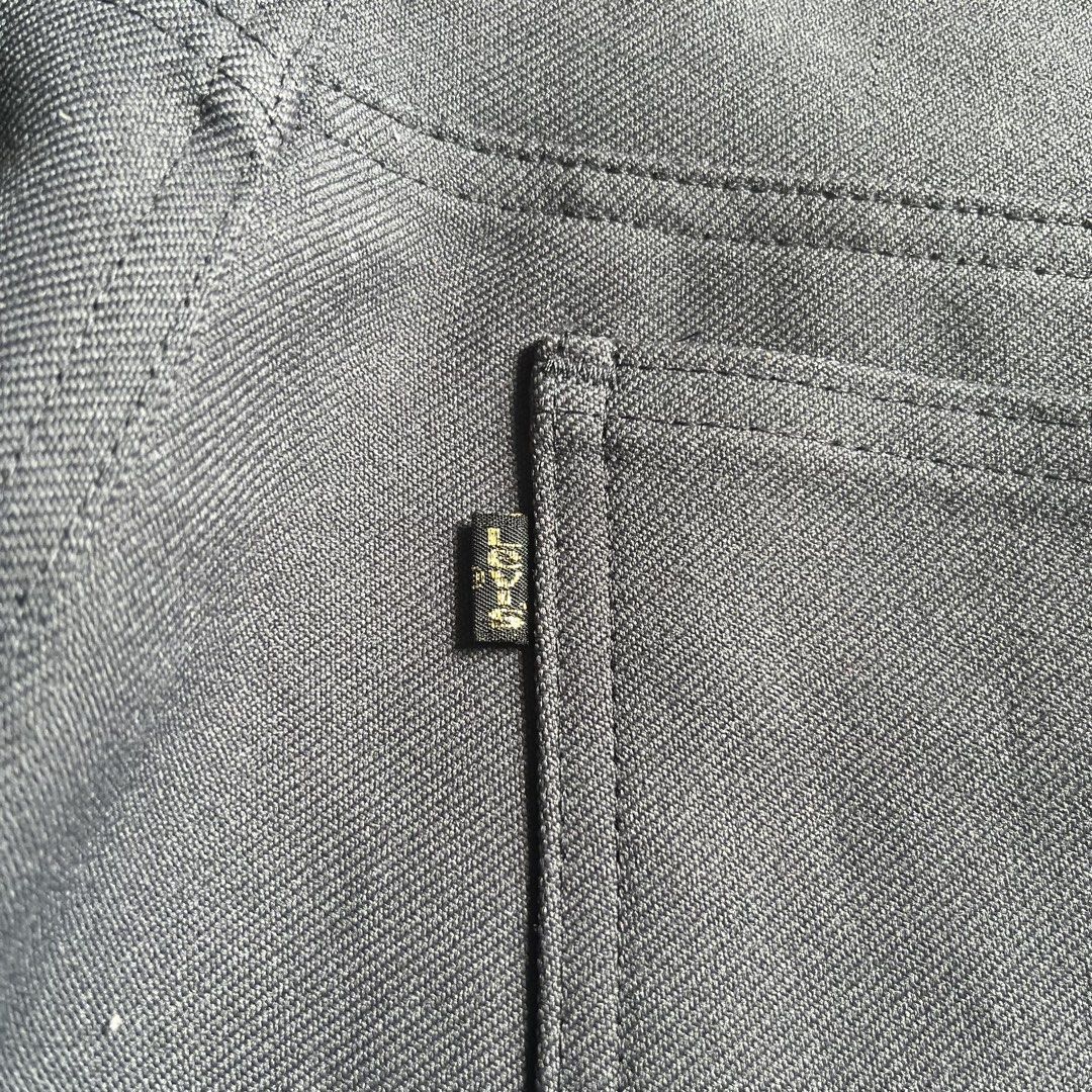 Vintage Levi's Sta-Prest Grey Flare Pants (Category: Jeans) located in Quezon City. Submitted by dahyunieeeeee (Listing ID 1468079680, Image 3). Description: - Brand: Levi's - Color: Classic grey - Fit: Mid-rise with a timeless flare silhouette - Fabric: Structured twill with pressed front creases - Details: Belt loops, front pockets, back patch pockets, and iconic black tab with gold lettering - Hardware: Metal top button with Levi Strauss brand