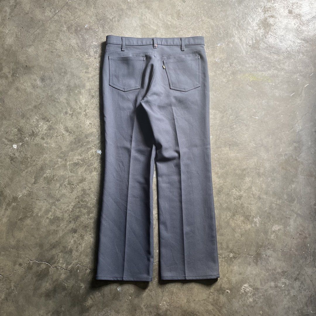 Vintage Levi's Sta-Prest Grey Flare Pants (Category: Jeans) located in Quezon City. Submitted by dahyunieeeeee (Listing ID 1468079680, Image 2). Description: - Brand: Levi's - Color: Classic grey - Fit: Mid-rise with a timeless flare silhouette - Fabric: Structured twill with pressed front creases - Details: Belt loops, front pockets, back patch pockets, and iconic black tab with gold lettering - Hardware: Metal top button with Levi Strauss brand