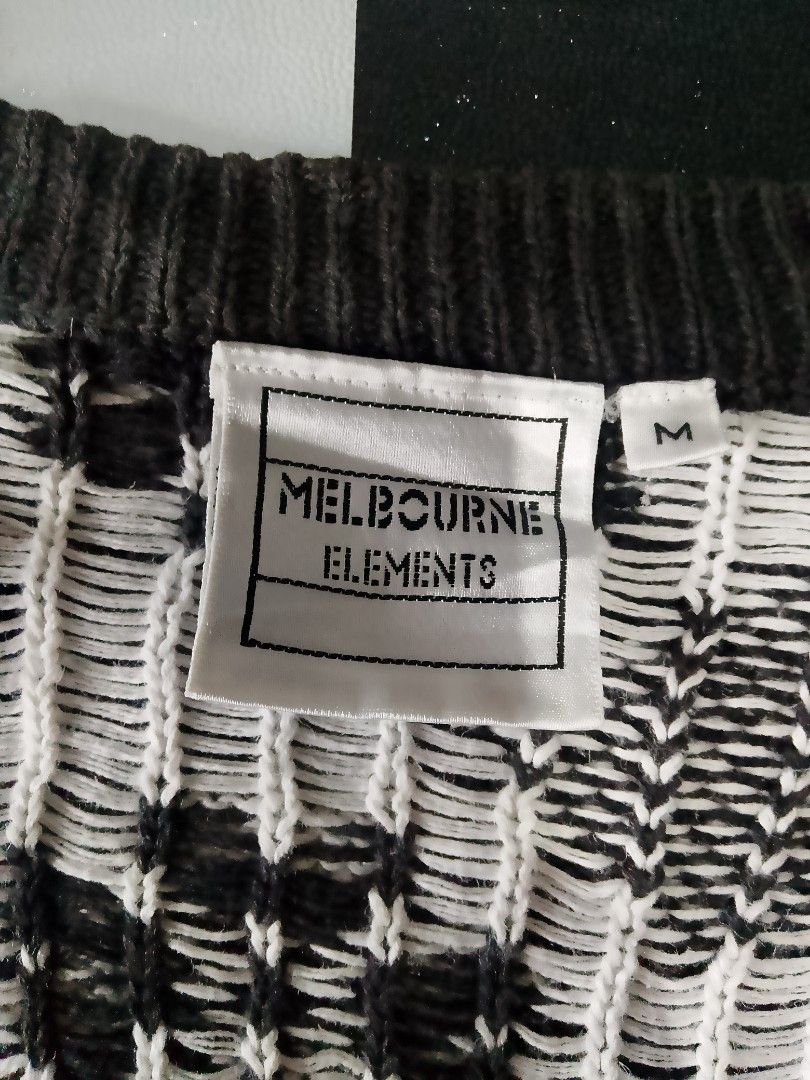 Vintage Melbourne Elements Cardigan (Category: Coats, Jackets and Outerwear) located in Binan City. Submitted by incnt (Listing ID 1468076005, Image 3). Description: 250 Pesos only add shipping fee Vintage Melbourne Elements Cardigan Size Medium 21*26 Very good condition *Issue ❗: 1 missing button The item in the image is a vintage black and white jacquard patchwork cardigan by the brand Melbourne Elements. It features a distinct V-neck button-up
