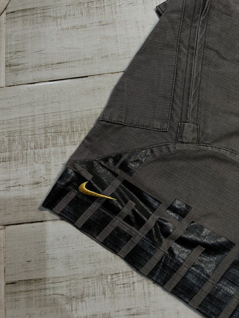 Vintage Nike Brown Cargo Trek Shorts (Category: Shorts) located in Angono. Submitted by odd.fitt (Listing ID 1468093572, Image 2). Description: Large on tag 32W 23L 12H 6 pockets Vent zips Adjustable waist With draw strings With extra buttons Embroidered swoosh and Nike script Complete tags No issue.