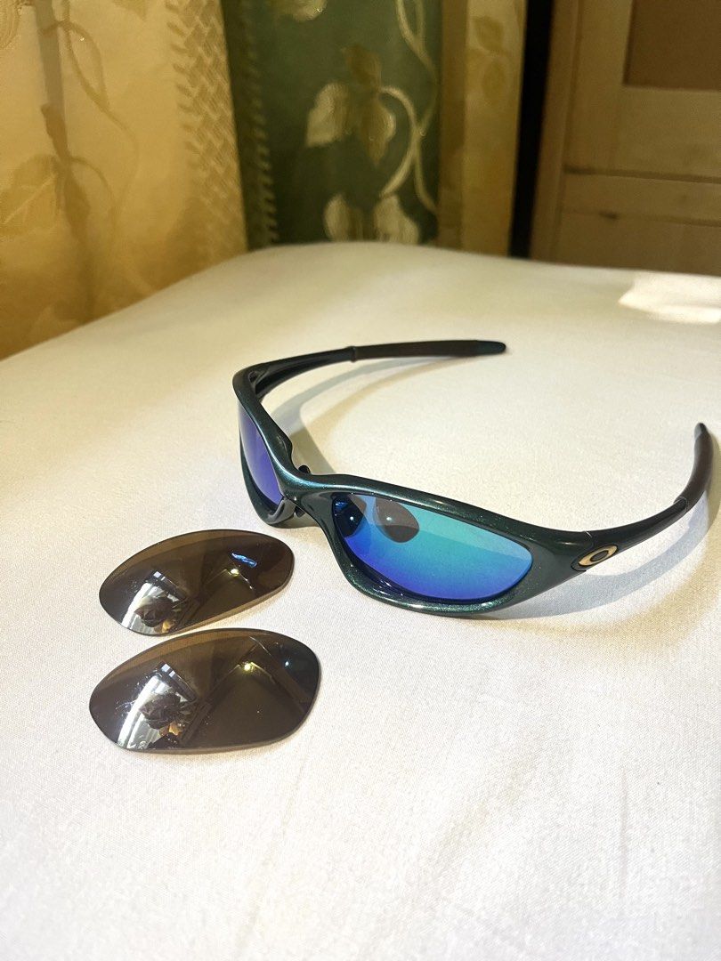 Vintage Oakley xx twenty (Authentic) (Category: Sunglasses & Eyewear) located in Santa Barbara. Submitted by megs012 (Listing ID 1468118692, Image 3). Description: 2000 Oakley XX twenty emerald green (With gold iridium lens) Frame 9/10 or better New lens 9.5/10 or better Original lens 7.8/10 or better slight scratches only.