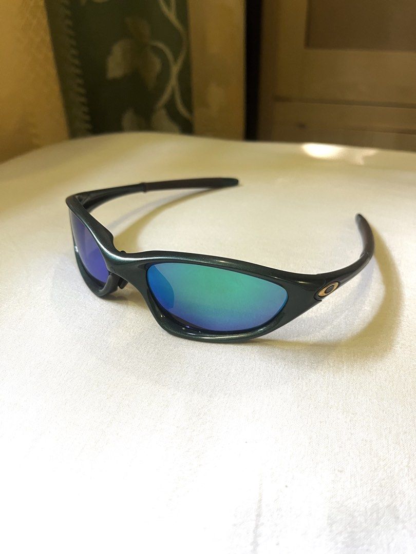 Vintage Oakley xx twenty (Authentic) (Category: Sunglasses & Eyewear) located in Santa Barbara. Submitted by megs012 (Listing ID 1468118692, Image 2). Description: 2000 Oakley XX twenty emerald green (With gold iridium lens) Frame 9/10 or better New lens 9.5/10 or better Original lens 7.8/10 or better slight scratches only.