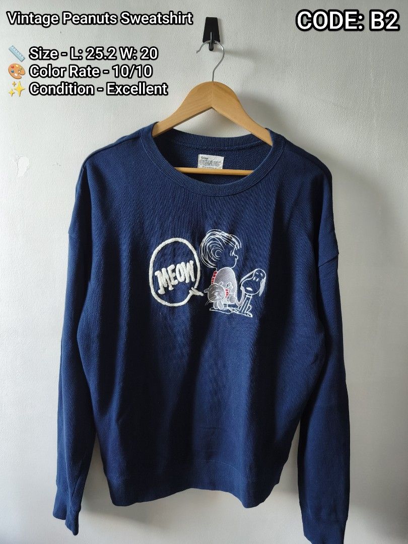 Vintage Peanuts Sweatshirt Navy Blue Snoopy Code B2 (Category: Coats, Jackets and Outerwear) located in Manila. Submitted by gelog2 (Listing ID 1468144095, Image 1). Description: - Style: Vintage Peanuts crewneck sweatshirt - Color: Navy blue - Graphic: Snoopy with 'MEOW' speech bubble - Size: Length 25.2", Width 20" - Features: Ribbed cuffs and hem.