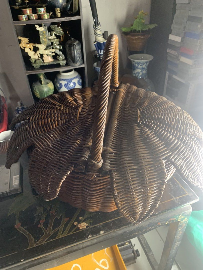 Vintage wicker basket with handle and leaf design (Category: Storage Boxes & Baskets) located in Quezon City. Submitted by sojisup (Listing ID 1468168668, Image 3). Description: - Handmade dark brown woven rattan basket - Unique leaf or petal-shaped split lid design - Sturdy twisted handle for easy carrying - Deep round interior offers plenty of storage space - Versatile piece, great for home decor and organizing.