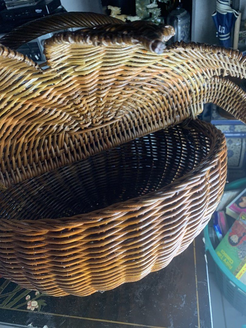 Vintage wicker basket with handle and leaf design (Category: Storage Boxes & Baskets) located in Quezon City. Submitted by sojisup (Listing ID 1468168668, Image 2). Description: - Handmade dark brown woven rattan basket - Unique leaf or petal-shaped split lid design - Sturdy twisted handle for easy carrying - Deep round interior offers plenty of storage space - Versatile piece, great for home decor and organizing.
