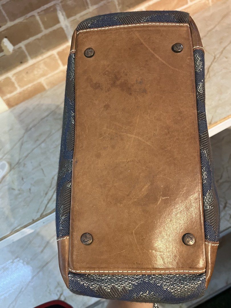 Vivienne Westwood (Category: Luxury Bags & Wallets) located in Manila. Submitted by hello_juicyyyy (Listing ID 1468279560, Image 3). Description: Vintage Vivienne Westwood Bag Fabric/Leather Approx dimensions: 21x28x12cm Good condition, hardly worn Bag shows some light wear throughout, mainly to lining, hardware, brown leather (scratches) and the bottom of the bag Please refer to all photos for the exact condition.