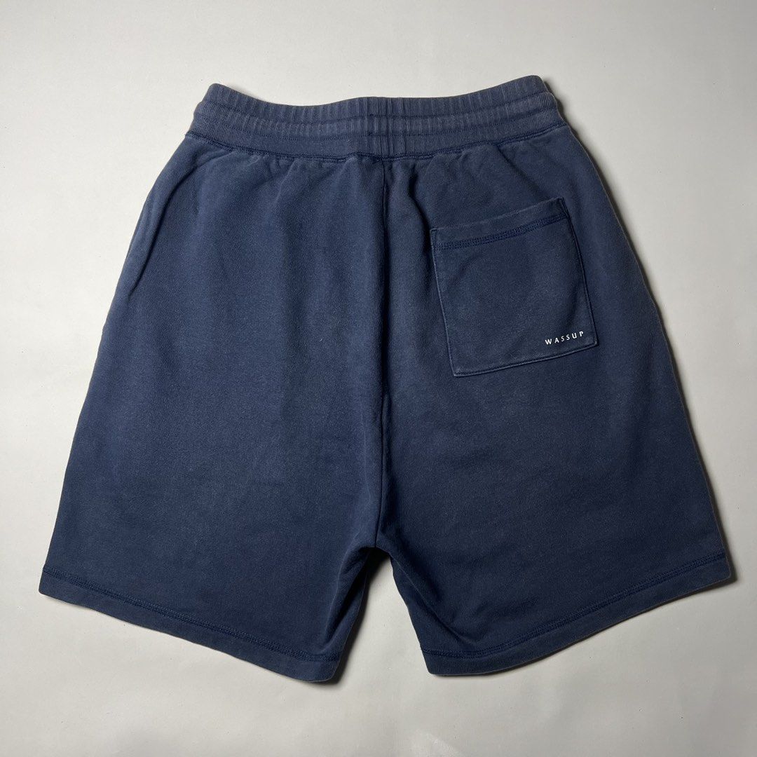 Wassup Navy Blue Sweat Shorts Size M (Category: Shorts) located in Manila. Submitted by drnsy06 (Listing ID 1468283241, Image 1). Description: - Brand: Wassup -waist 28-28 L20 T14 H11 - Color: Navy Blue - Size: Medium - Material: Soft cotton - Waistband: Elastic with matching drawstring - Pockets: Convenient side pockets and one back pocket - Details: White Wassup text print on back pocket and small blue logo tag on left hem - Condition/Use: Grea
