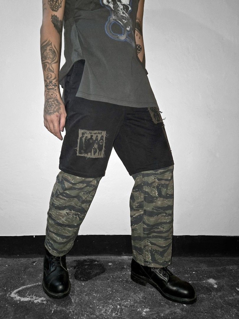 WEARy Studios patchwork camo trousers (Category: Trousers) located in Caloocan City. Submitted by wearystudios (Listing ID 1468218570, Image 1). Description: "CAMO" overlayed trousers Cut-out trousers with extended length from military pants scraps, patches all over with our XV.OID logo patch at the back 1/1 Waist 29-30 Crotch 17.5 Thigh 12.5 Length 39 Leg opening 9 8,500.