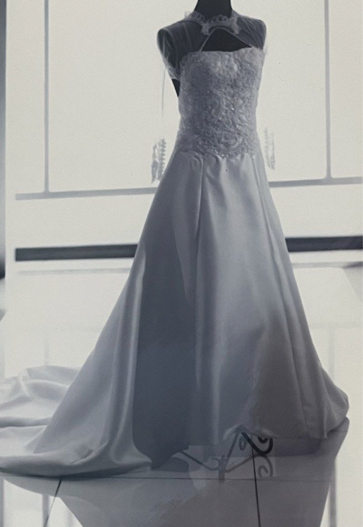 Wedding Gown (Category: Evening dresses & gowns) located in Binan City. Submitted by winds06 (Listing ID 1468206284, Image 1). Description: Selling Wedding Gown. Used. Already dry cleaned. Complete set. with trail, Cushion, Rosary cord, Veil, Wedding pouch, Guest book, candle. Size Large. See through sleeve, open back..