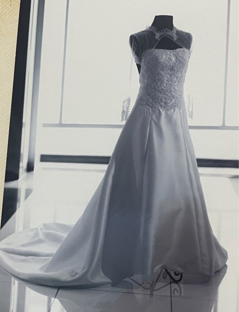 Wedding Gown (Category: Evening dresses & gowns) located in Binan City. Submitted by winds06 (Listing ID 1468206284, Image 2). Description: Selling Wedding Gown. Used. Already dry cleaned. Complete set. with trail, Cushion, Rosary cord, Veil, Wedding pouch, Guest book, candle. Size Large. See through sleeve, open back..