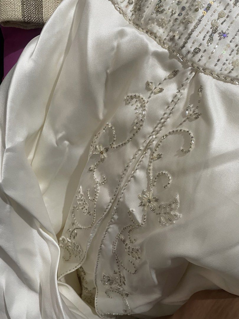 Wedding Gown (Category: Evening dresses & gowns) located in Binan City. Submitted by winds06 (Listing ID 1468208596, Image 3). Description: Selling Brandnew Wedding Gown. Tube Type. Hand beadworks frontal, back and train. Cushion included. Rosary cord.l, coins. Size: Large.