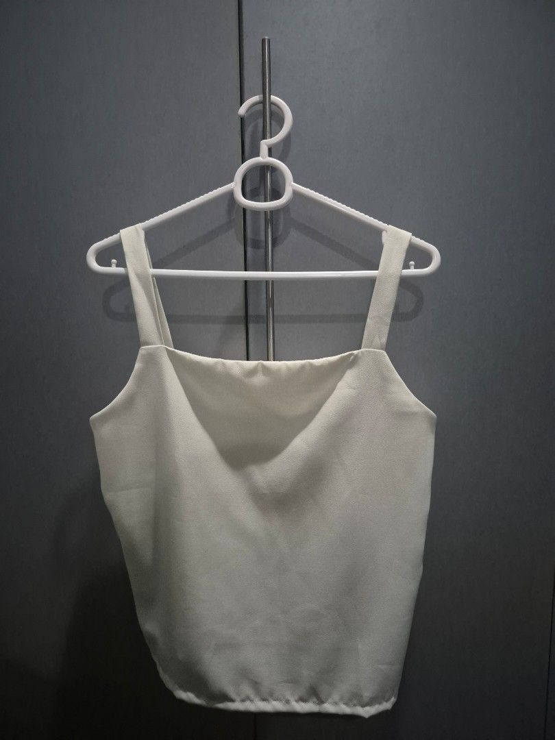 White Basic Sleeveless Top (Category: Sleeveless) located in Pasig City. Submitted by jeneee_0824 (Listing ID 1468117350, Image 1). Description: .