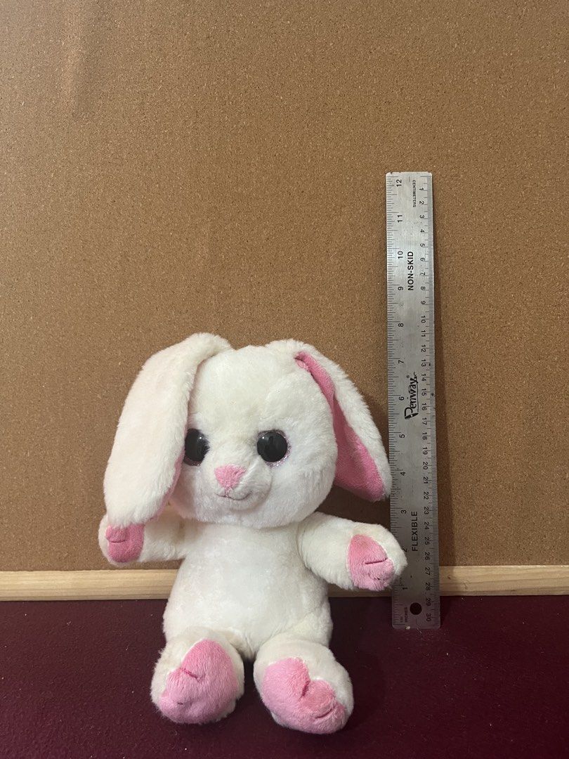 White Bunny Rabbit Plush (Category: Plushies & Soft Toys) located in Baguio. Submitted by gaara1234 (Listing ID 1468073267, Image 1). Description: - Item: White bunny stuffed animal - Size: Approx. 20 cm tall (sitting position) - Features: Big sparkly black eyes, soft plush fur, pink inner ears, nose, and paw pads - Condition: Clean, no tears, and no loose threads.