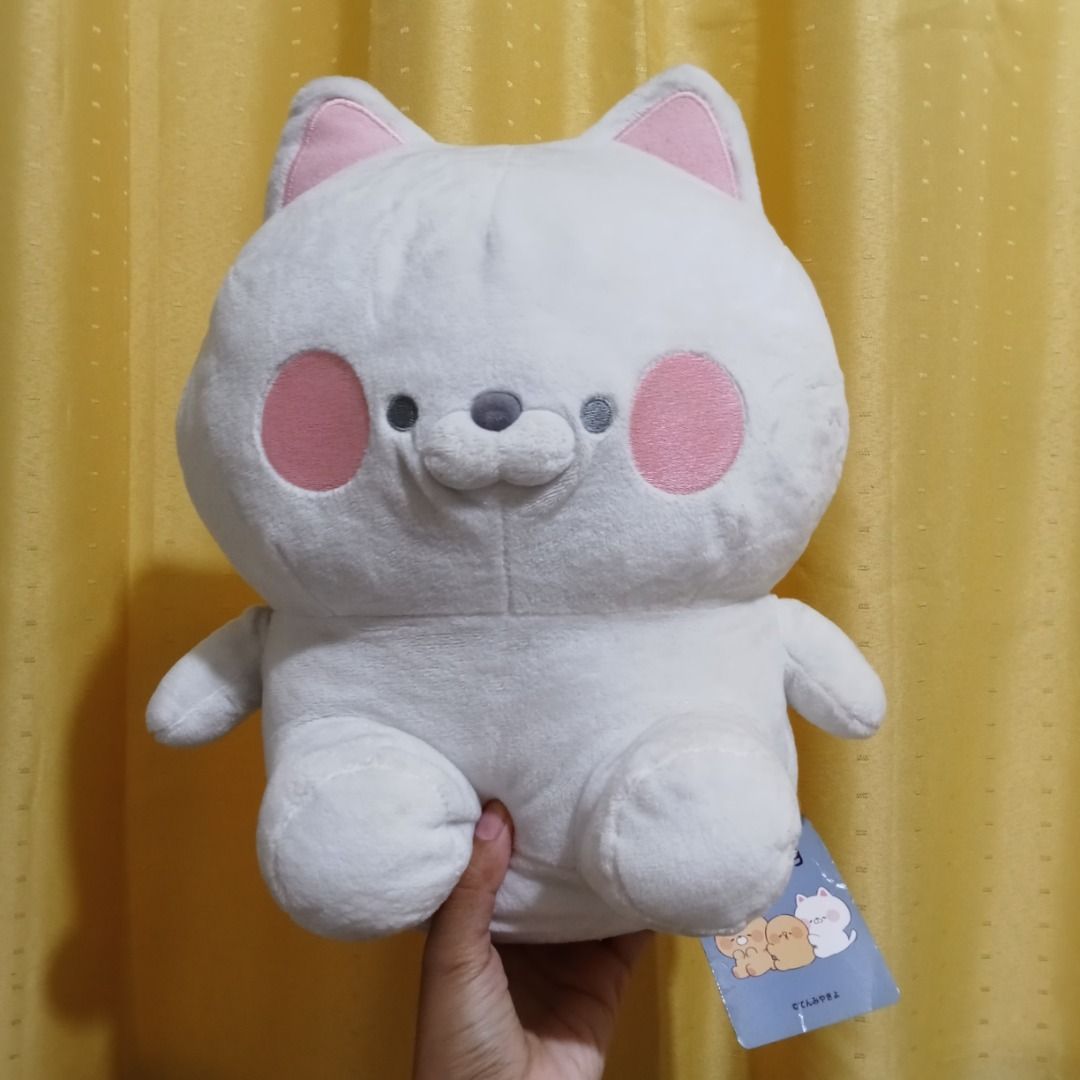 Kimipiyo Neko plush (Category: Plushies & Soft Toys) located in Quezon City. Submitted by trinket_cat (Listing ID 1468073368, Image 1). Description: -White cat plush toy stuffed animal soft cute pink cheeks - Super soft white cat plush toy - Features cute big pink cheeks, pointy ears, and a small tail - Great hugging size for plushie lovers - Brand new with original hang tags attached .