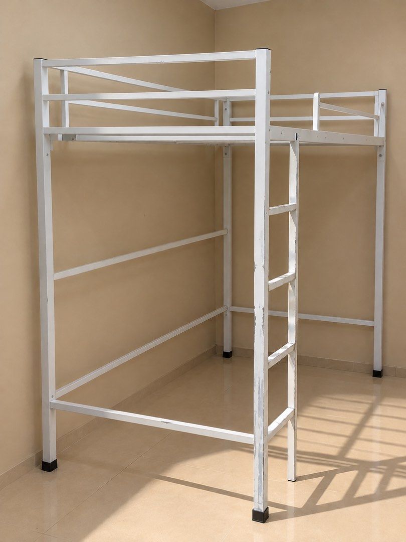 Double size White Metal Loft Bed Frame (Category: Bed Frames & Mattresses) located in Cavite. Submitted by ecustodio_19 (Listing ID 1468140194, Image 1). Description: - Type: White metal loft bed frame - Features: Attached front vertical ladder and secure top safety railings - Space-saving: Open under-bed area ideal for a desk, sofa, or storage - Condition: Good and sturdy, with minor paint chipping and wear on the ladder posts (need to repaint) 