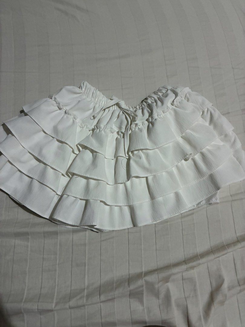 White Multi-Tiered Ruffle Skirt with Drawstring Waist (Category: Skirts) located in Paranaque City. Submitted by intheaftrglw (Listing ID 1468199093, Image 1). Description: ruffled mini skirt; stretchable.