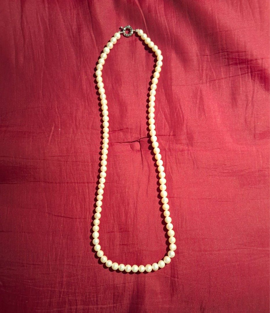White pearl necklace with silver-toned clasp (Category: Necklaces) located in Muntinlupa City. Submitted by everythingmustgo_8475da (Listing ID 1468094027, Image 1). Description: - Elegant white pearl necklace featuring round, uniform pearls - Secure silver-toned toggle clasp closure at the back - Versatile classic accessory perfect for casual or formal outfits - Clean condition overall and ready to wear - Great addition to any jewelry collection