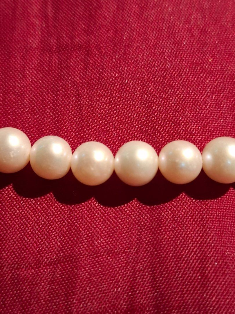 White pearl necklace with silver-toned clasp (Category: Necklaces) located in Muntinlupa City. Submitted by everythingmustgo_8475da (Listing ID 1468094027, Image 3). Description: - Elegant white pearl necklace featuring round, uniform pearls - Secure silver-toned toggle clasp closure at the back - Versatile classic accessory perfect for casual or formal outfits - Clean condition overall and ready to wear - Great addition to any jewelry collection