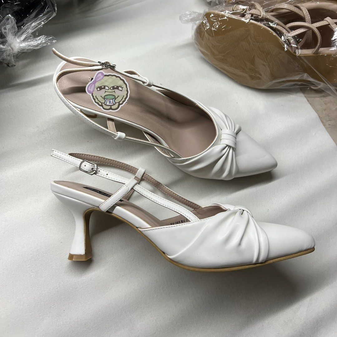 White Pointed Toe Slingback Heels with Bow Detail (Category: Heels) located in Antipolo. Submitted by chi._.declutters (Listing ID 1468241426, Image 1). Description: loc: marikina / lower antipolo area marikina-made, matibay available: size 8 and 10 +100 for tranpo if meetup.