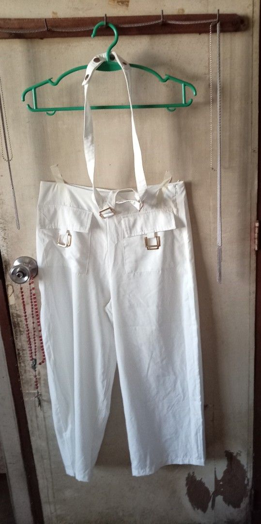 White trousers with halter neck strap and front pockets (Category: Sets or Coordinates) located in Quezon City. Submitted by chacha30.s (Listing ID 1468064053, Image 1). Description: - Trendy white wide-leg trousers - Features unique halter-style neck straps - Front patch pockets with stylish buckle hardware - Flattering mid-rise fit and clean straight cut - Convenient side zipper closure - Easy to match with simple tops or crop tees . Text me at