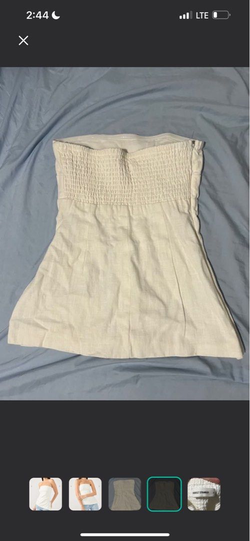 White Tube Top (Category: Sleeveless) located in Manila. Submitted by shecuratedit (Listing ID 1468115197, Image 3). Description: - Brand: Perfect Stranger (Menorca Strapless model) - Size: AU/UK 6 (US 2) - Color: White - Details: Smocked back panel, side zip closure, structured fit - Condition: Worn once, fresh and clean - Styling: Versatile; easy to dress up with jeans or a skirt.