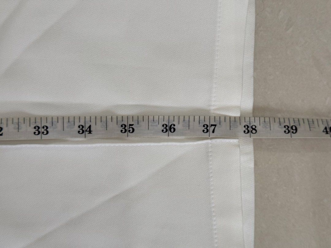 White Wide Leg Trousers with Tortoiseshell Button (Category: Jeans) located in Manila. Submitted by trinketsofhappiness (Listing ID 1468081025, Image 3). Description: - S-M - Color: Crisp white - Style: Wide-leg trousers with pleated front details - Waist: Elastic back waistband with front button closure - Pockets: Functional side pockets - Length: Approximately 37 inches - Fabric: Lightweight and easy-moving - Versatility: Perfect for both casua