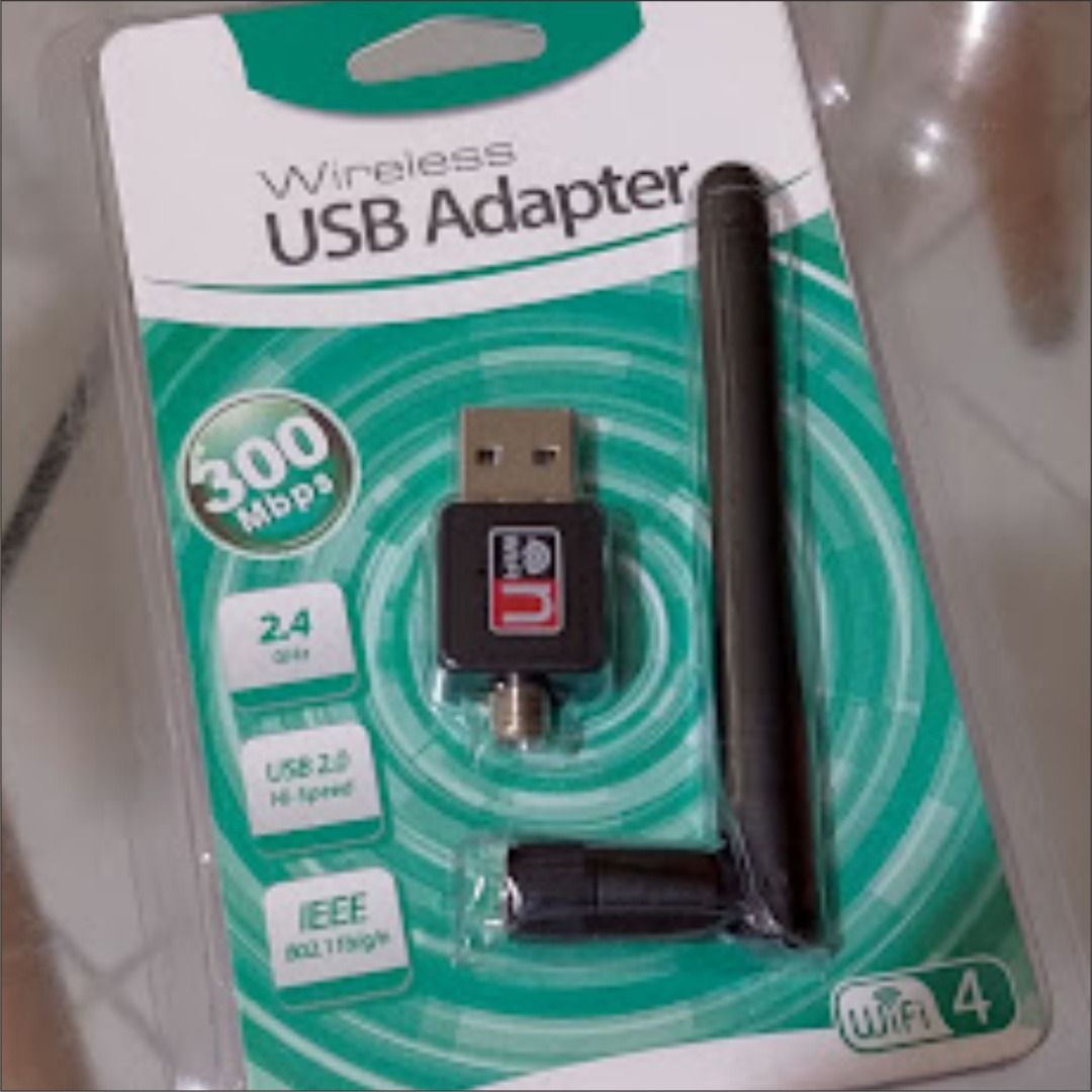 Wireless USB Adapter 300 Mbps with Antenna (Category: Cables & Adaptors) located in Quezon City. Submitted by susmaryosep1 (Listing ID 1468184847, Image 2). Description: - Condition: Brand new, sealed in original blister packaging - Speed: Up to 300 Mbps (WiFi 4 standard, 2.4 GHz frequency) - Antenna: Equipped with an external antenna for stronger signal reception - Interface: -Speed USB 2.0 - Compatibility: IEEE 802.11b/g/n standards - Perfect f