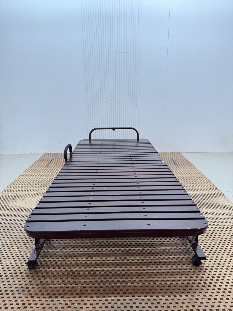 Wooden folding bed (Category: Bed Frames & Mattresses) located in Quezon City. Submitted by matetdevis13 (Listing ID 1468228302, Image 1). Description: Wooden Single Folding Bed Price: 4,900 36 x 78.5 x 11.5 In good condition Code JMD18-M239.