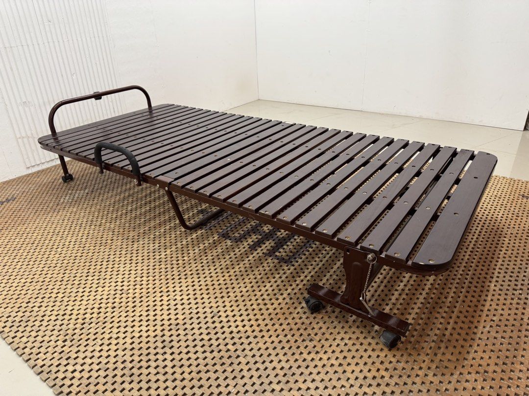 Wooden folding bed (Category: Bed Frames & Mattresses) located in Quezon City. Submitted by matetdevis13 (Listing ID 1468228302, Image 3). Description: Wooden Single Folding Bed Price: 4,900 36 x 78.5 x 11.5 In good condition Code JMD18-M239.