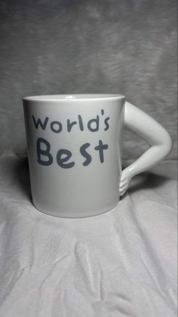 World’s Best 🍑 Funny Mug (Category: Coffee & Tea Tableware) located in Manila. Submitted by mug.aras (Listing ID 1468221033, Image 1). Description: Add some humor to your morning coffee routine or gift it to the “World’s Best 🍑” person in your life! This hilarious white ceramic mug features a muscular arm as a handle on one side and a cheeky butt crack illustration printed on the back..