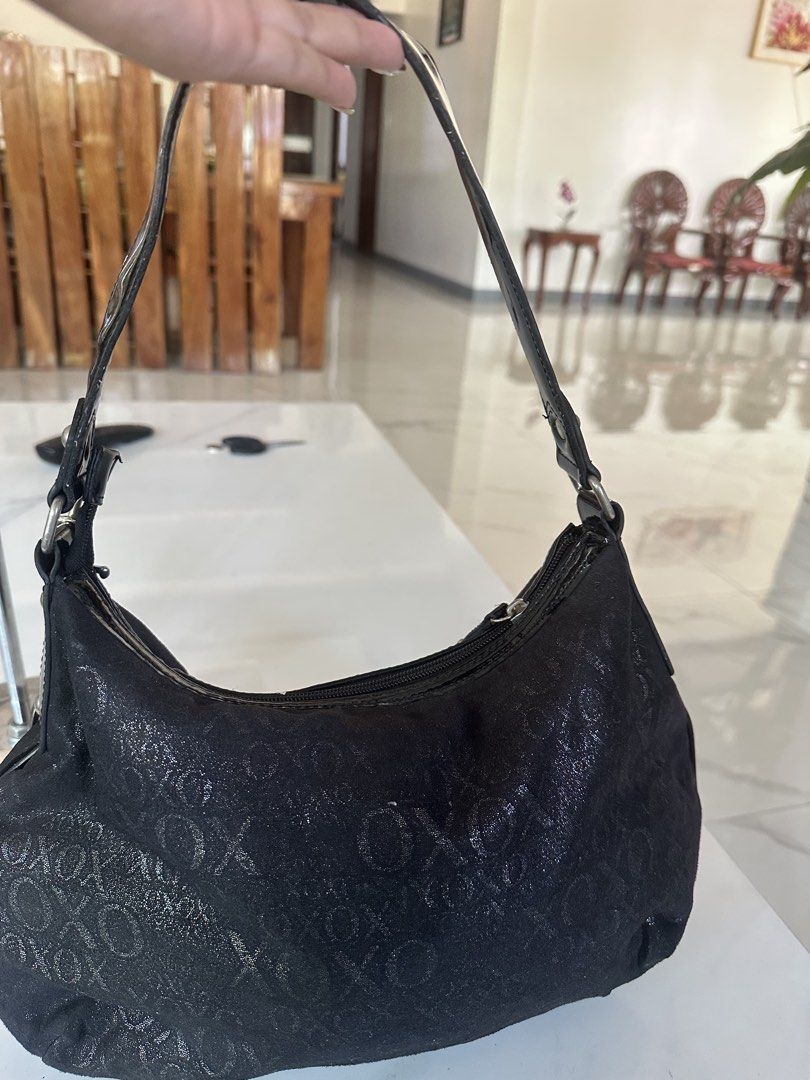 XOXO Black Shimmer Shoulder Bag (Category: Shoulder Bags) located in Manila. Submitted by goldenhorse-dafc (Listing ID 1468094509, Image 3). Description: - Brand: XOXO - Style: Shoulder bag / Handbag - Color/Pattern: Black with all-over sparkly monogram - Details: Patent black trim, glossy handle, and front buckle with XOXO logo - Extras: Includes silver-tone ring keychain with heart charms - Closure: Zipper top - Interior: Patterned lining with 