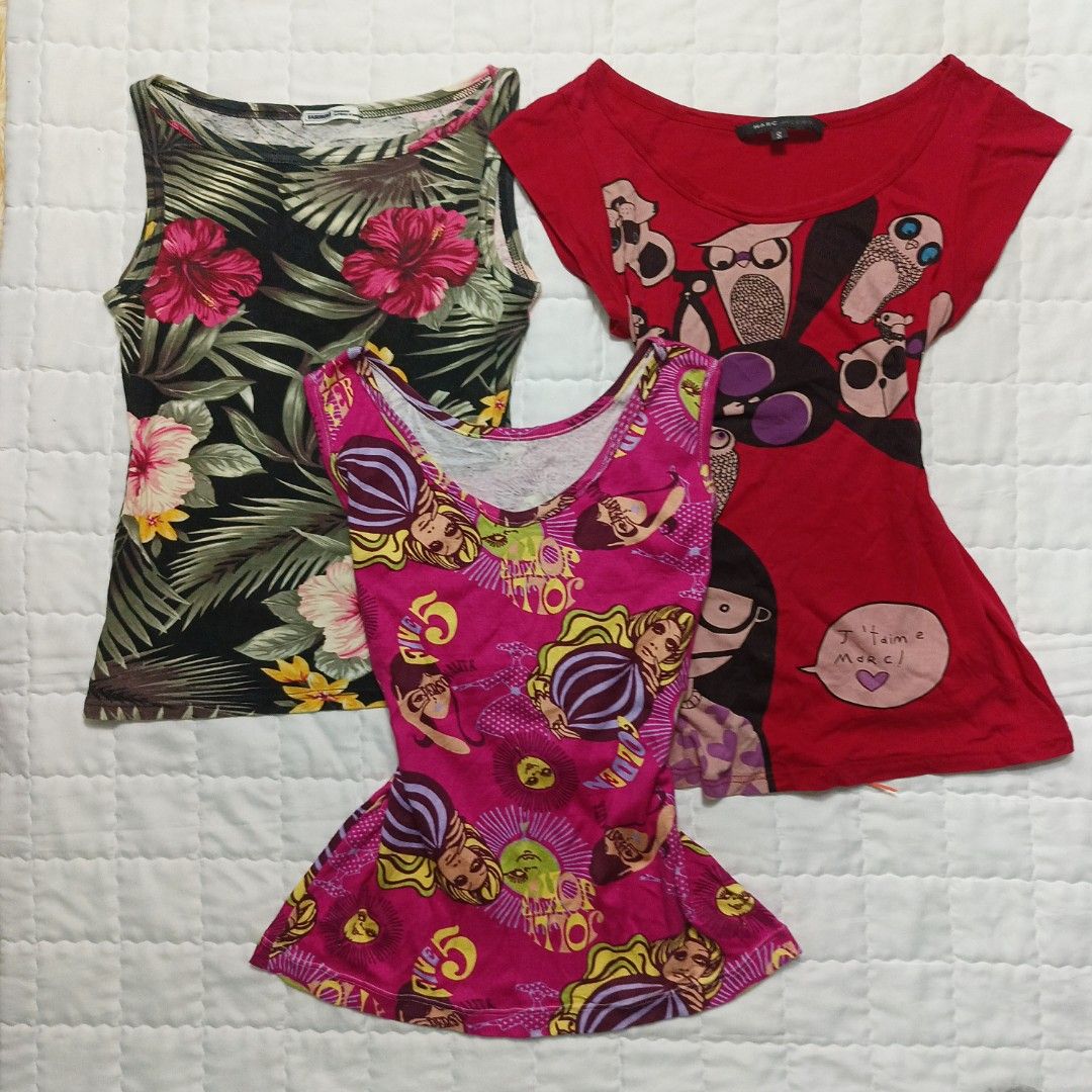 Y2k Sleeveless Shirt "Barcelona" (Category: Blouses) located in Cavite. Submitted by yaelarkai0_ (Listing ID 1468183309, Image 1). Description: All in excellent condition, for sizes please message as they have their own individual sizes. Everything is available except the red Marc Jacobs top..