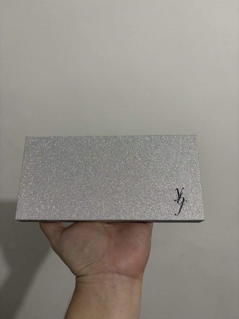 ybf Blingtastic Eyeshadow Palette (Category: Makeup) located in Valenzuela. Submitted by shopevrday (Listing ID 1468204286, Image 2). Description: Ybf Blingtastic eyeshadow palette in original box. Box is opened but the palette is guaranteed unused. Includes 12 neutral and warm shades ranging from shimmers to mattes, built-in mirror, and dual-ended brush. Shade names include diva, bashful, supermodel, runway, bronzified, show stopper, daring, gol